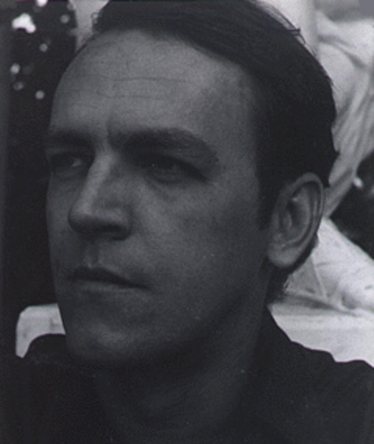 Gustav Hasford looking to the side